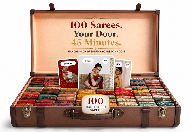 An open Pinit suitcase holding 100 handpicked sarees, with featured saree cards standing inside the lid